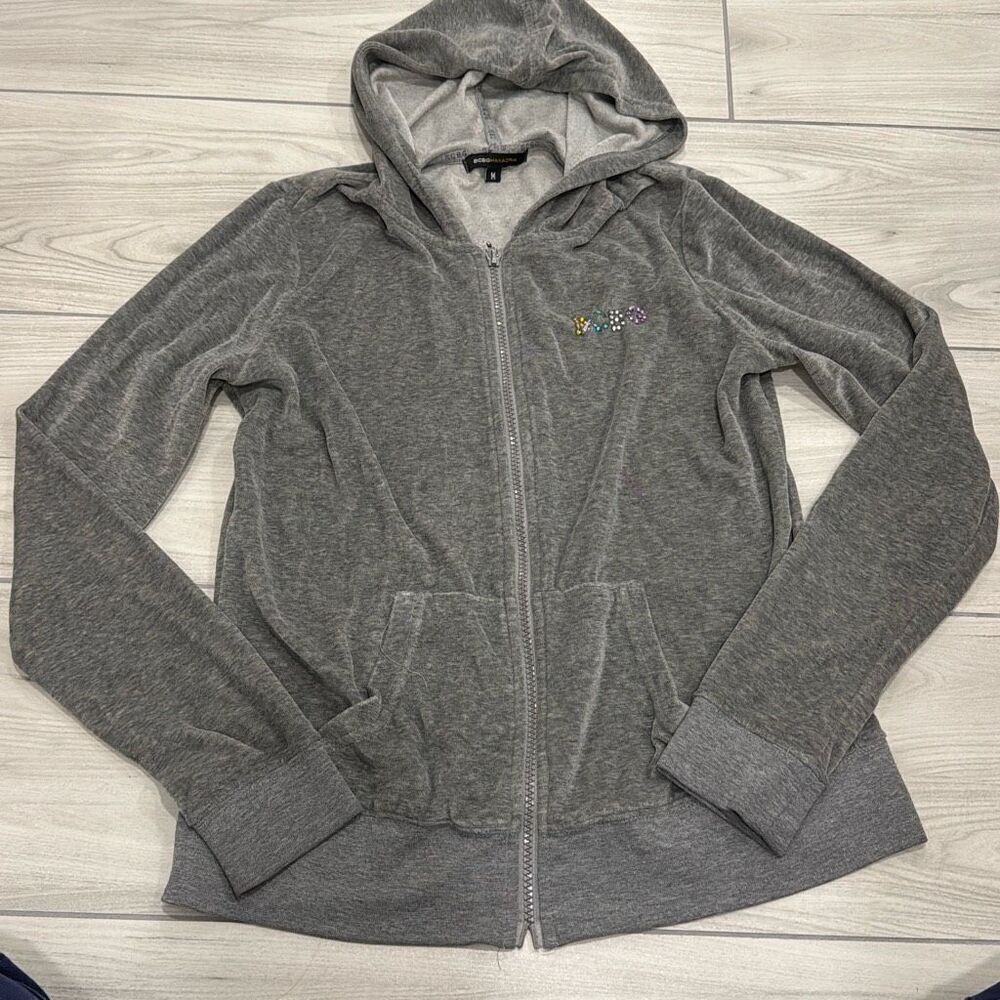 bcbg maxazria gray zip up size medium with a crown jewel detailing sewed on.. su
